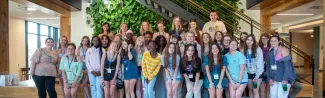 A group of high school students poses for a photo