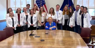 UNE medical students and administration pose with Maine Gov. Janet Mills