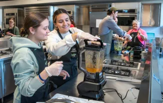 UNE occupational therapy students perform an exercise preparing blended foods for patients with limited swallowing capabilities