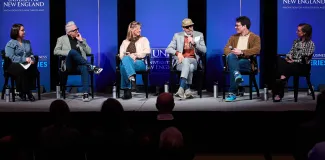 A panel of speakers onstage