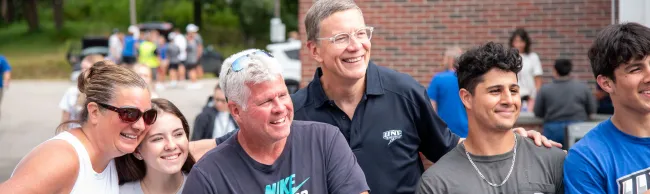UNE President James Herbert poses with new and returning students