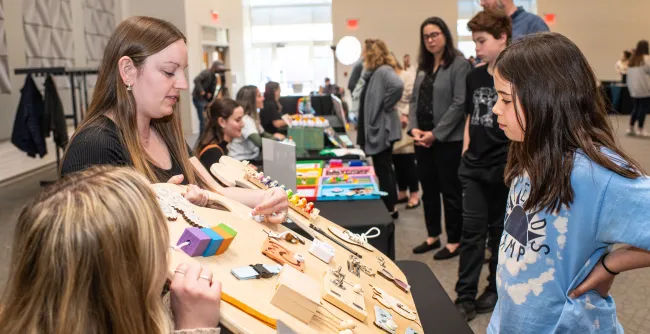 A child examines a sensory board 
