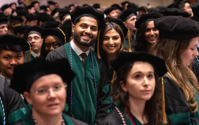 Hammad and Hafsa Sadiq smile at graduation