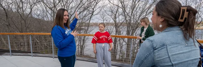 UNE professor and student show a curious middle-schooler the ropes of marine research