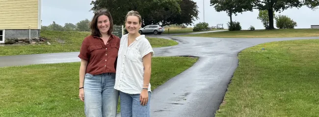 UNE student and mentor pose for outdoor photo