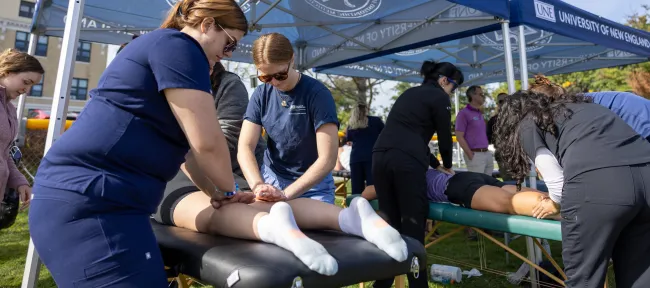 UNE medical students treat runners after the Maine Marathon