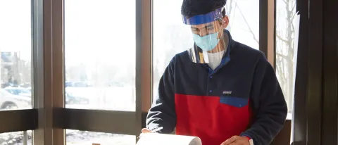 Mohammad Atif-Sheikh (Medical Biology, ’23) checks vaccination paperwork