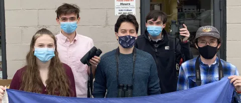 UNE Birding Club poses in front of Biddeford Food Pantry