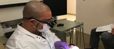 CJ Castonguay works on a patient at the Katahdin Valley Health Center