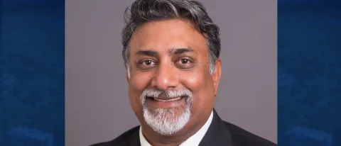 Head shot photo of Kash Dutta