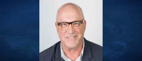 Daniel Pierce portrait; man smiling directly at camera