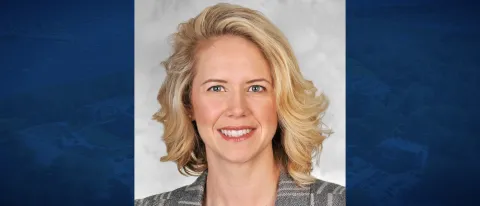 Portrait of woman, blonde, smiling at camera