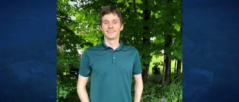 Man smiles for portrait. 