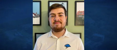 Man smiles for portrait. 