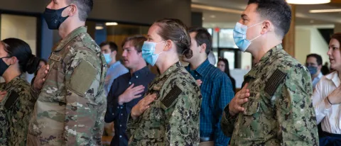 ROTC students pledge allegiance to the flag