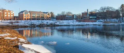 View of Biddeford Campus on the water and with snow