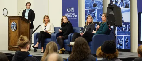 A panel of women sports figures - Emma Tiedemann, Reagan Carey, Abigail Thelin, Heather Davis, and Angela Ruggiero