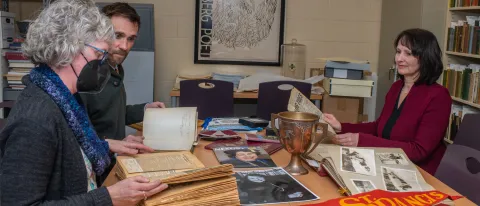 UNE archivists examine the Featherman collection
