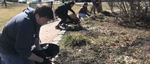 Students cleaning park