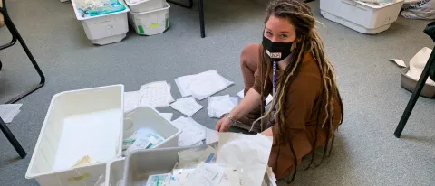 Carina McAllister (Medical Biology, ’25) sorts through medical supplies on a medical mission in Bangladesh