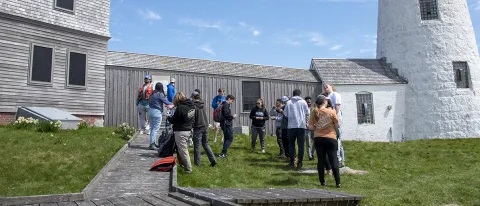 A panoramic image of the Wood Island Lighthouse in Biddeford, where several leadership students gather to teach each other survival skills