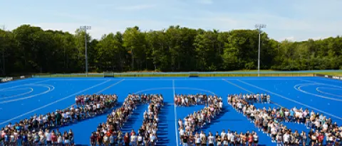 The Class of 2026 poses for a photo in an arranged pattern depicting the year "2026"