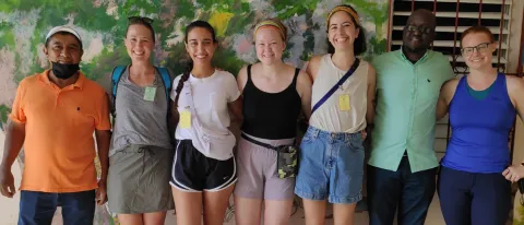 UNE student Celia Larson poses with a group of peers at the Hillside Health Center