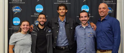 Kena Gilmour poses with Storming to Change students and Ed Silva 