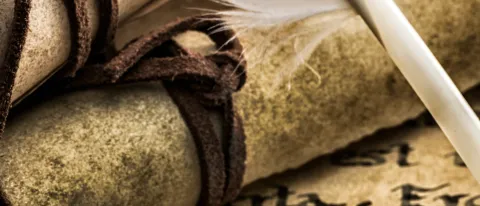 An image of a scroll and quill