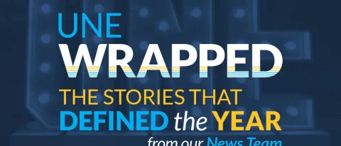 Graphic with writing saying "UNE Wrapped: The Stories That Defined The Year, from our News Team"