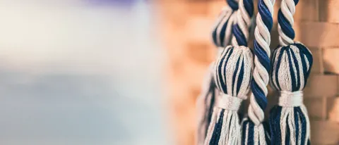 Blue and white graduation cords