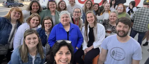Various occupational therapy faculty and students pose for a photo at the AOTA conference in Kansas City, Missouri
