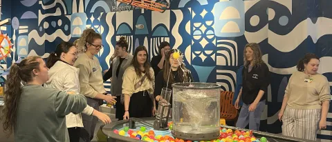 Students play with water mechanisms at the Children's Museum in Portland