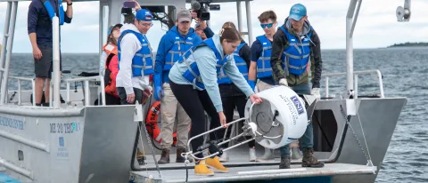 Students and faculty deploy a real-time shark detection buoy in Saco Bay