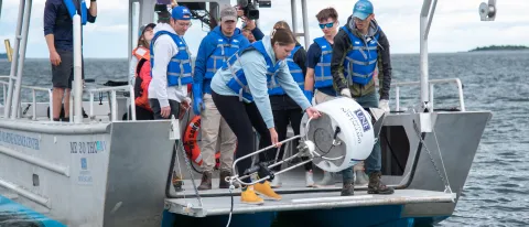 Students and faculty deploy a real-time shark detection buoy in Saco Bay