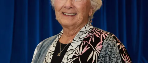 Polly Campbell poses with the Kim Day Service Award 