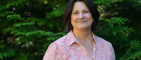 Portrait of Jennifer Morton against trees