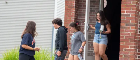 Students exit Assisi Hall