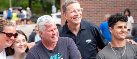 UNE President James Herbert poses with new and returning students