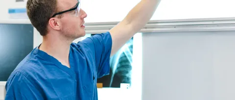 A student evaluates x-rays in the human body donor lab