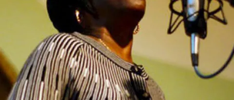 Bettie Mae Fikes sings into a microphone