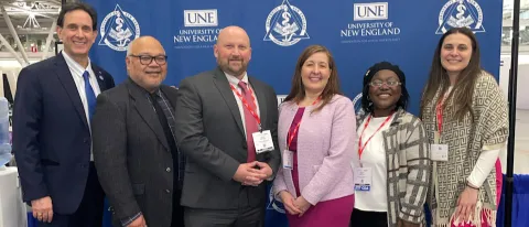 Several UNE dental medicine educators pose for a photo