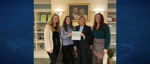 UNE COM check donation