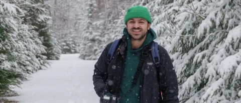 Portrait of a man in the show holding a camera
