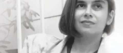 A black and white photo of a woman looking off-camera