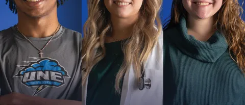 Three UNE students pose against blue backgrounds