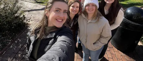 A group of UNE students and faculty take a selfie in front of Philadelphia's Independence Hall