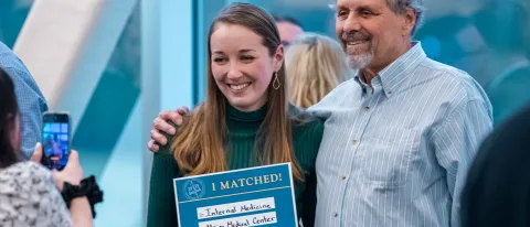 A UNE medical student poses with family on Match Day