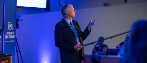 Cameron Wake addresses audience at climate talk