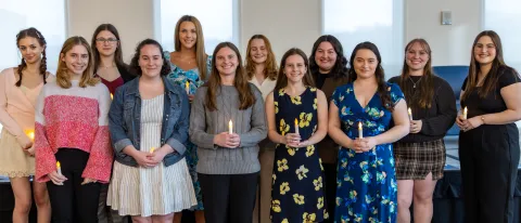 A photo of a group of students posing at the PSI CHI induction